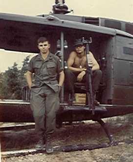 Spec 5 Ron Stucker behind the M-60 with WO Andre